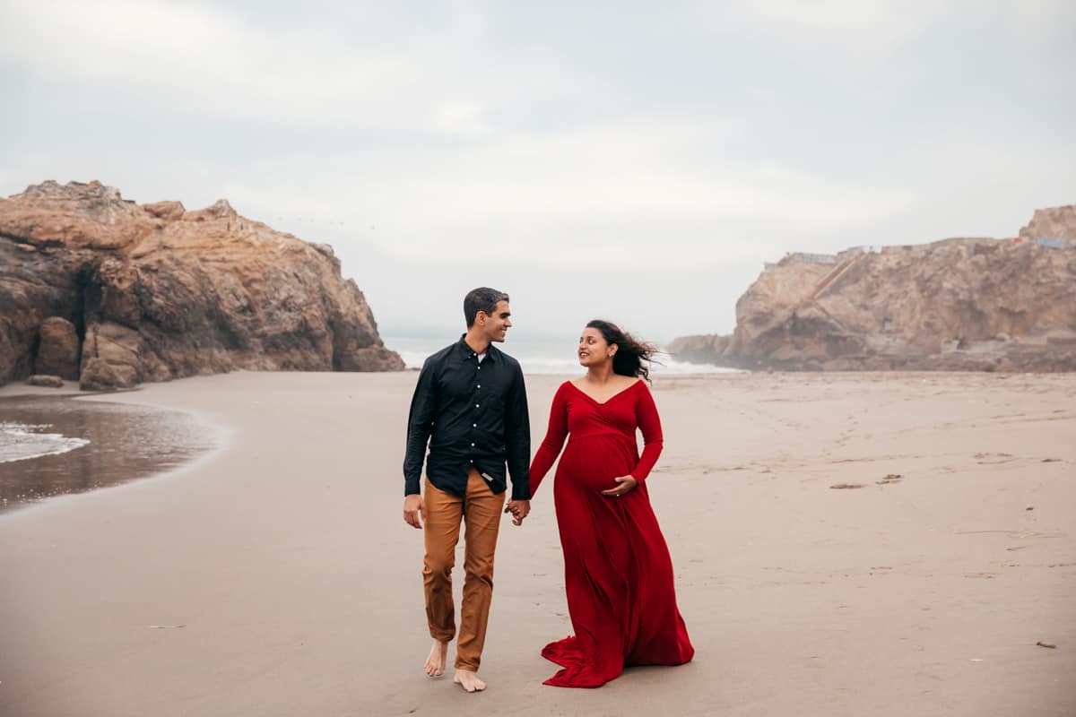 couple on beach for pregnancy shoot in San Francisco