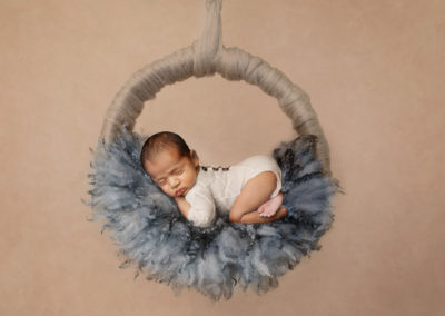 baby in hanging wreath